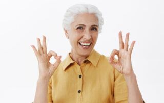 smiling-beautiful-senior-woman-showing-okay-gesture-approve-and-like-idea-guarantee-service